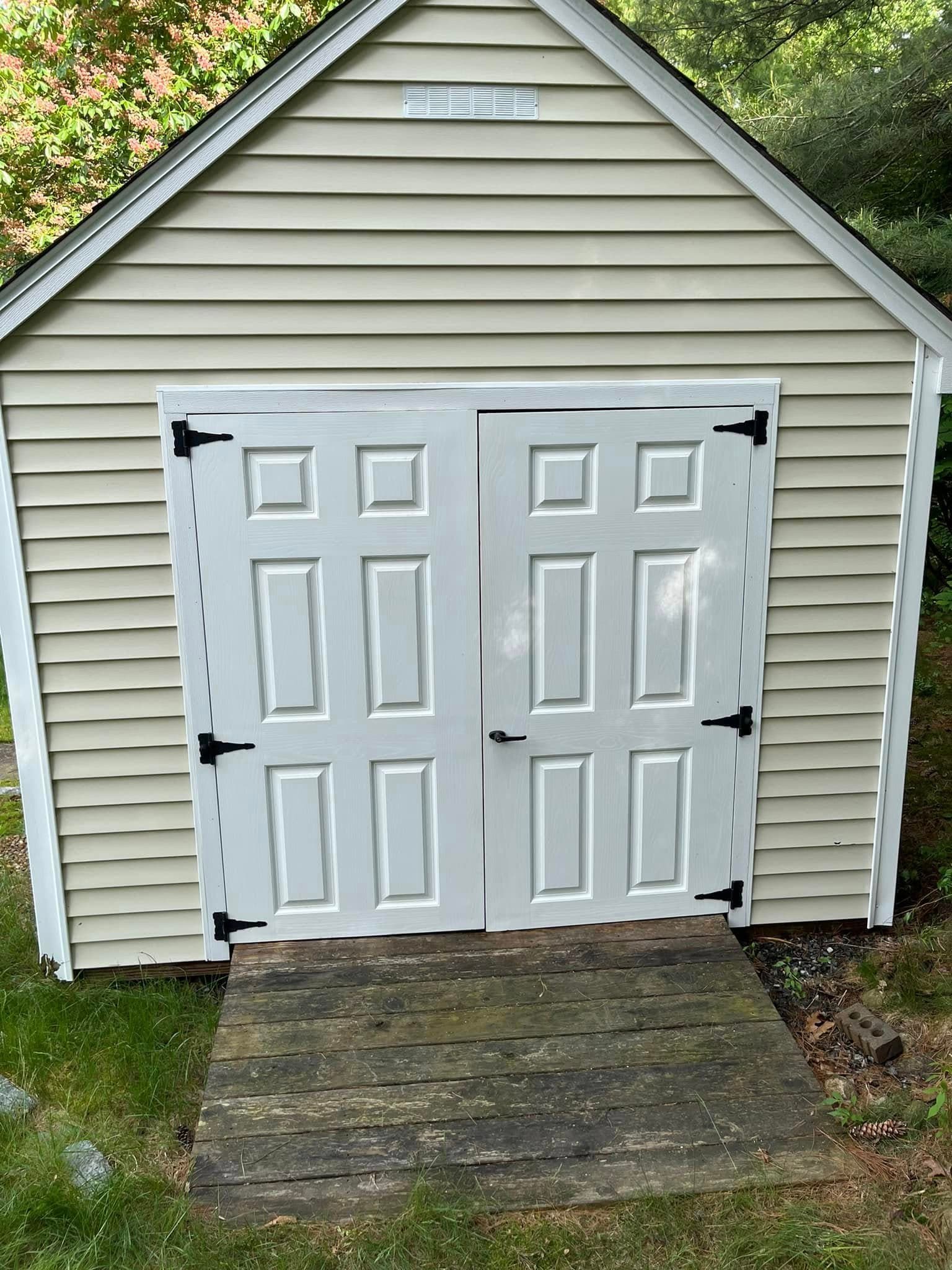 Clean outdoor shed after pressure washing